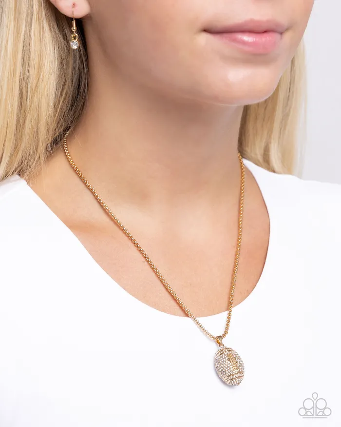 Paparazzi Accessories Necklaces End Zone Elegance Gold White Rhinestone Football Short Necklace Paparazzi